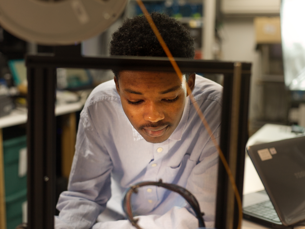 Yoseph at 3D printer